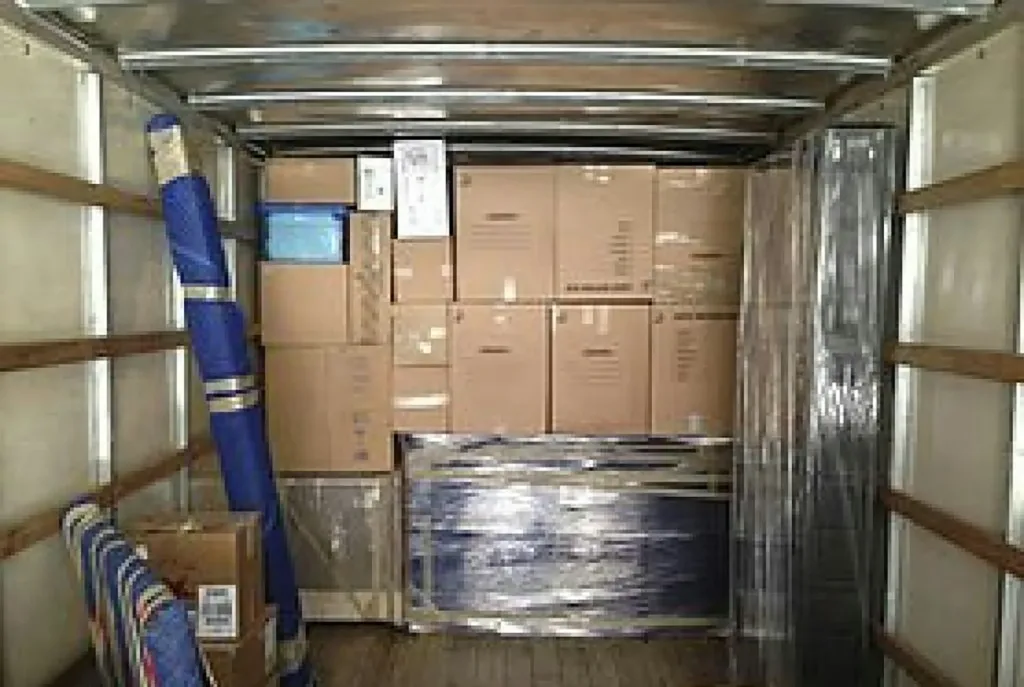 a truck with a bunch of boxes in the back of it